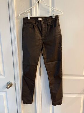 Gianni Bini dark brown skinny jeans feature a coated, leather-like finish